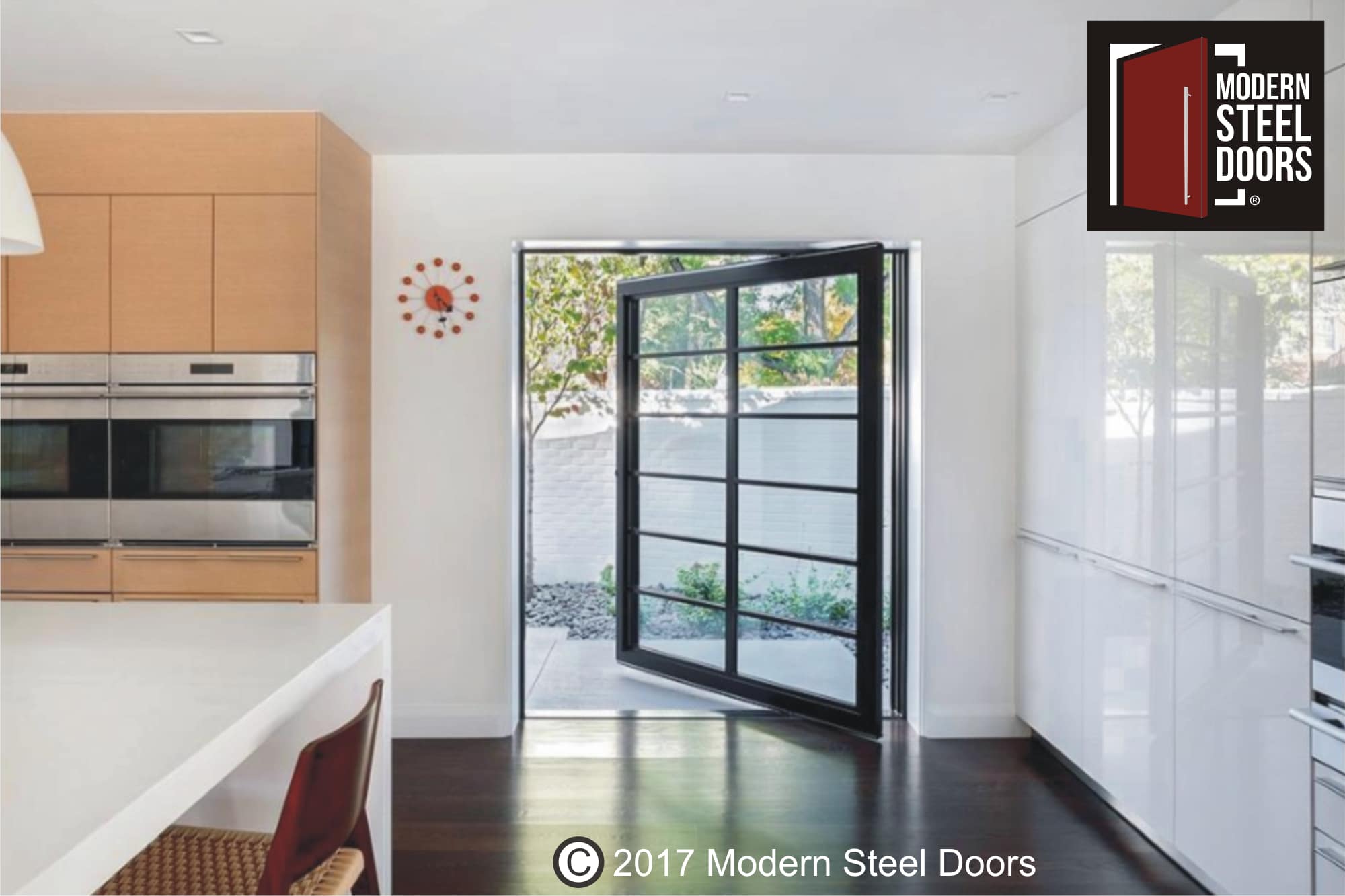 large custom modern front door made of glass panels and round black door pulls