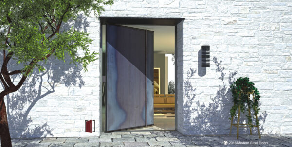 raw metal pivot exterior front door with round artisan door hardware on white brick home