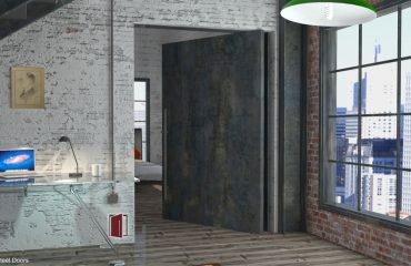 modern entrance pivot door made of raw steel with round door hardware in urban setting