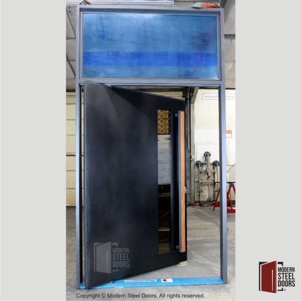 Blackened Steel Pivot Door With Transom