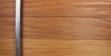 modern wooden pivot door made of mahogany wood and round polished door accessories