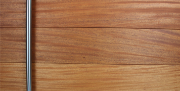 mahogany hardwood modern front door behind stainless steel door components