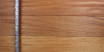 contemporary wooden front door made of mahogany hardwood and round polished door hardware