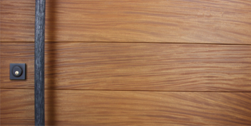modern wood door made of teak with round custom door handles and square black lock