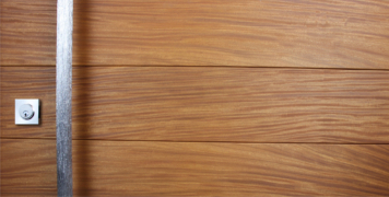 real teak wood door with polished handcrafted door handle and square stainless steel door lock