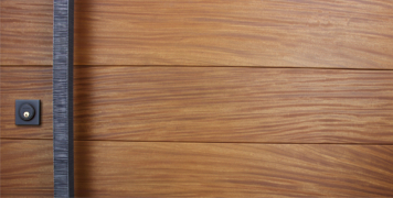teak genuine wood door behind square modern door handles and black sqaure door lock