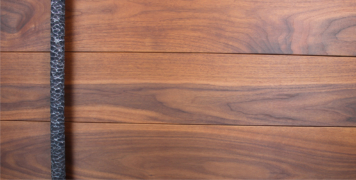 walnut hardwood door with round modern steel door pulls