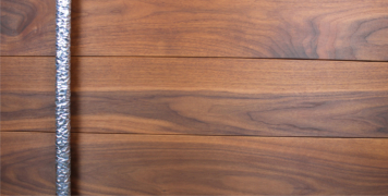 walnut wood exterior door with long round door hardware