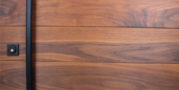 modern entry door pulls and door lock powder-coated black with genuine walnut wood