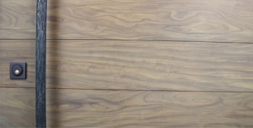 genuine washed teak wood door behind handcrafted round door pulls and square black door lock