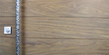 modern front door made of washed teak wood with unique door handles and square stainless steel door lock