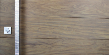 fancy polished door handles and stainless steel door lock with washed authentic teak wood