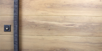 white oak wooden door with square door hardware and black baldwin mechanical door lock